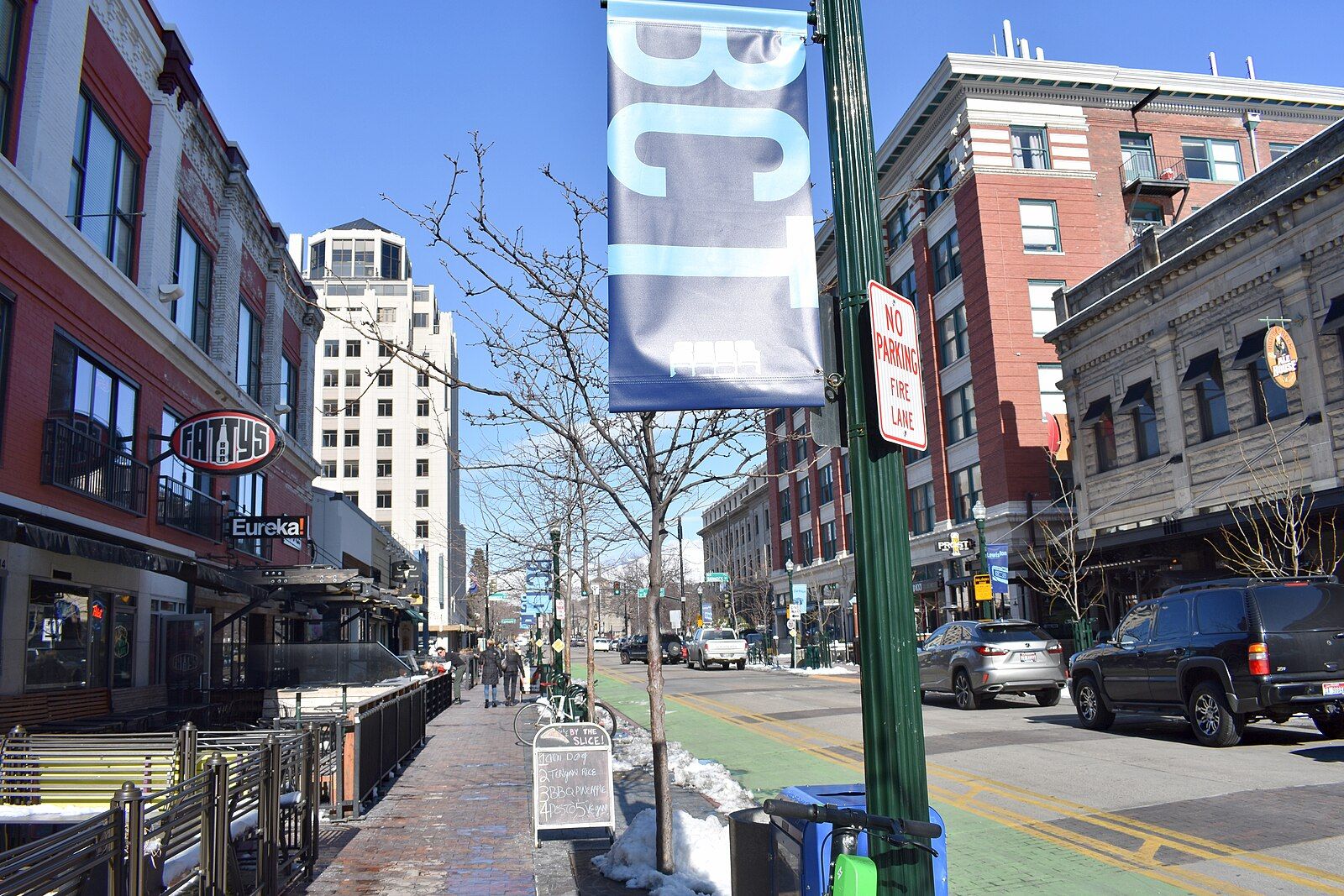 Storefronts and historic brick buildings along 8th Street in downtown Boise